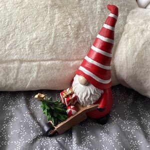 Gnome pushing wheelbarrow